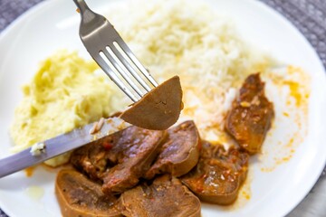 Classic rustic Brazilian food, beef tongue with rice and mashed potatoes. Real food