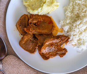 Classic rustic Brazilian food, beef tongue with rice and mashed potatoes. Real food