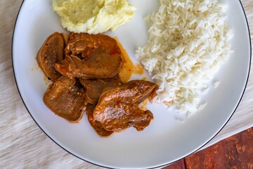 Classic rustic Brazilian food, beef tongue with rice and mashed potatoes. Real food