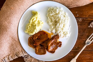 Classic rustic Brazilian food, beef tongue with rice and mashed potatoes. Real food