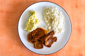 Classic rustic Brazilian food, beef tongue with rice and mashed potatoes. Real food