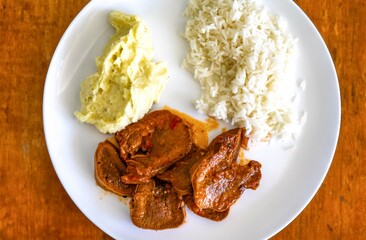 Classic rustic Brazilian food, beef tongue with rice and mashed potatoes. Real food