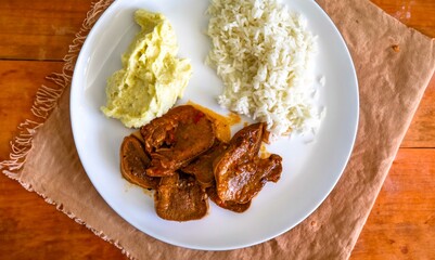 Classic rustic Brazilian food, beef tongue with rice and mashed potatoes. Real food