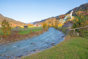 Partnach river and famous skijump at Garmisch-Partenkirchen, in autumn. bavarian landscape.