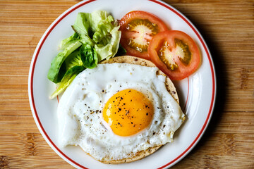 Healthy Fried Egg With Sllced Tomato And Lettuce