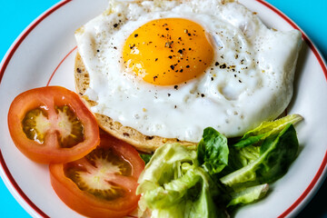 Healthy Fried Egg With Sllced Tomato And Lettuce