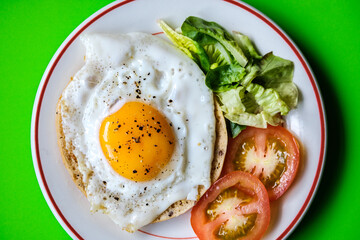 Healthy Fried Egg With Sllced Tomato And Lettuce