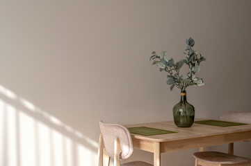 Warm sunny aesthetic Mediterranean dining room or kitchen interior, wooden table and armchairs,...