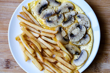 Open Mushroom Omelette With Fried Potato Chips Or Frites