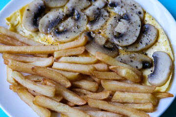 Open Mushroom Omelette With Fried Potato Chips Or Frites