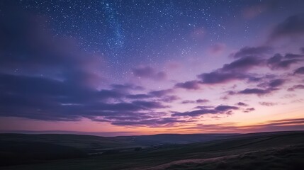 Stunning Night Sky Over Rolling Hills with Stars and Clouds at Twilight