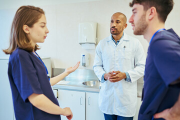 Medical team discussing patient care in modern hospital