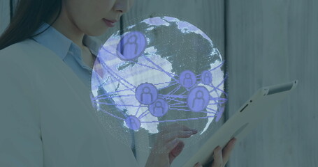 Projecting Chinese woman showing 3D globe above tablet in office, purple user icons, copy space