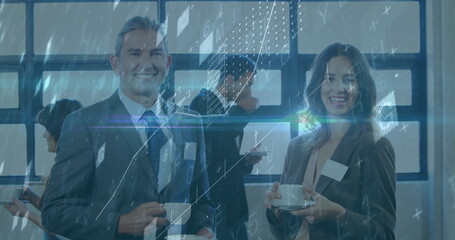 Smiling professionals in business attire holding coffee in conference room, checking smartphones