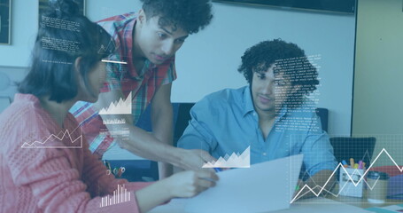 Collaborating on project, team using data visualization image in office setting