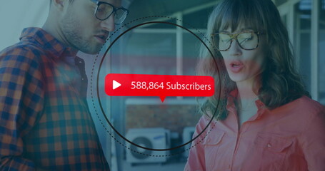 Coworkers reviewing subscriber count overlay in modern office, with red banner and dashed circle