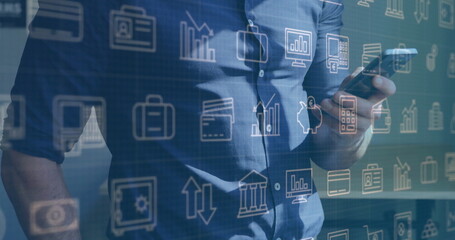 Holding smartphone male analyst viewing digital financial interface at office, with piggy bank icon