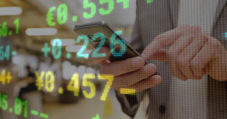 Tapping smartphone screen senior trader tracking currency overlays on trading floor, with suit