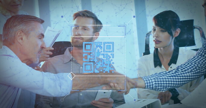 Leaning group reviewing smartphone in modern conference room, with translucent blue QR code overlay