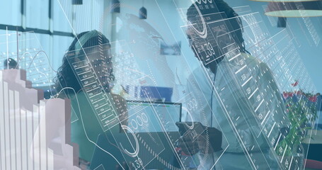 Collaborating team analyzing charts with laptop, tablet and data overlays at office