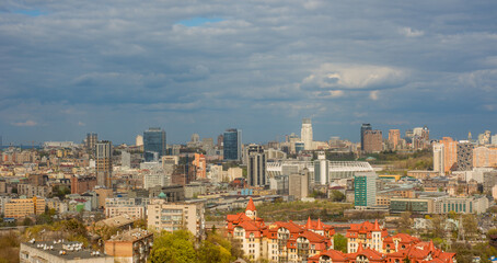 panoramic view of Kyiv with modern buildings and church domes for horizontal background