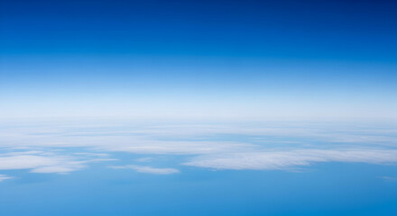 Fototapeta premium Vast and tranquil aerial perspective revealing a boundless blue sky seamlessly merging with a delicate layer of scattered white clouds on the far horizon