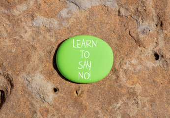 Learn to say no symbol. Concept words phrase Learn to say no on beautiful green stone. Beautiful...