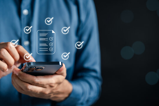 Digital checklist and document survey icons on mobile screen with checkmarks. Representing online feedback, satisfaction evaluation, task completion, and paperless form processing.