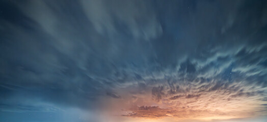 Beautiful night landscape, long exposure clouds, starry night.