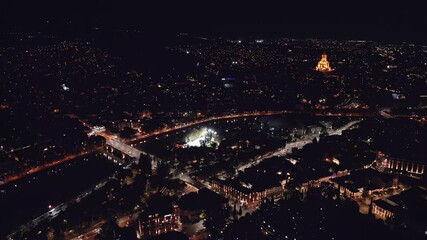 Tbilisi, Georgia - 28th october, 2024: aerial high panoramic view Georgia capital Tbilisi cityscape. Illuminated streets with vehicles in traffic. Avlabari and Marjanishvili district area