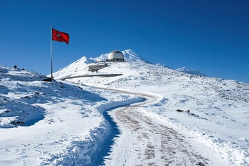 The snow-covered highlands of the Himalayas, with a red flag flying on one side and an observatory