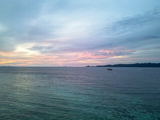 Vibrant Tropical Sunset Over Calm Ocean Waters in Indonesia