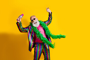 Photo of elderly cool old man have fun dance sing karaoke wear stylish striped suit boa sunglass...
