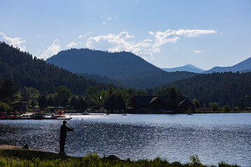 fishing on lake in the mountains