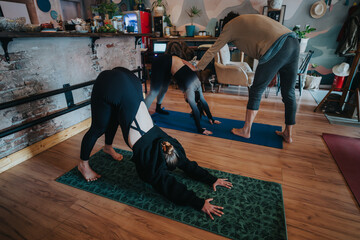 A cozy indoor setting where students practice yoga on mats while an instructor provides guidance,...