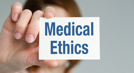 A person holding a card that says Medical Ethics