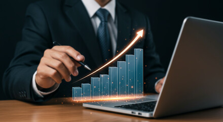 Business Growth Strategy: A businessman strategizes using a laptop, visualizing upward trending graph symbolizing business growth, success and future planning.