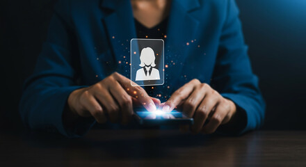 Digital Profile: A close-up shot captures a person's hands interacting with a smartphone, projecting a digital profile icon, representing concepts of technology and connection. 