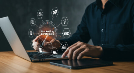 Digital Marketing Strategy: A professional focuses on an innovative marketing strategy while working with a computer.