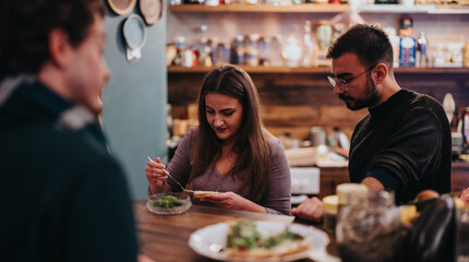 Friends gather in a contemporary kitchen to prepare and enjoy a meal together, emphasizing friendship, leisure, and culinary activities in a warm, inviting ambiance.
