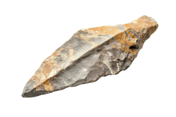 Primitive stone arrowhead showcasing intricate details and craftsmanship from ancient times, discovered in a historical excavation site