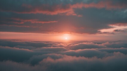 Fototapeta premium Sunset or sunrise over the clouds with a vivid sky and glowing horizon. Nature and sky scene. Atmospheric and scenic landscape. The concept of sunrise or sunset over clouds.