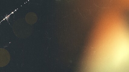 Warm light leak background with grunge texture, film grain, and dust, suitable for vintage or distressed effects
