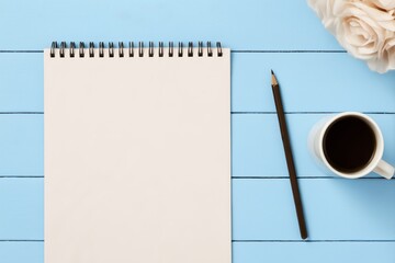 Pencil, sheet of paper and coffee mug.