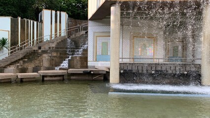 artificial waterfall decoration in a park where the public can relax