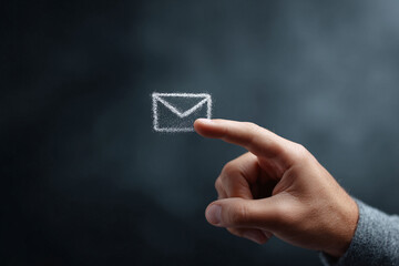 Finger touching glowing email icon. Concept for digital communication, contact, and connectivity. Suitable for tech, business, or marketing visuals.