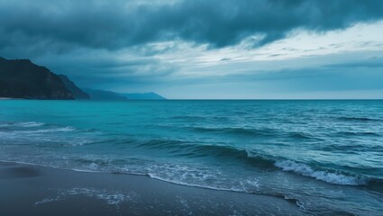 Fototapeta premium Coastal scene with ocean waves and mountainous coastline under cloudy sky.