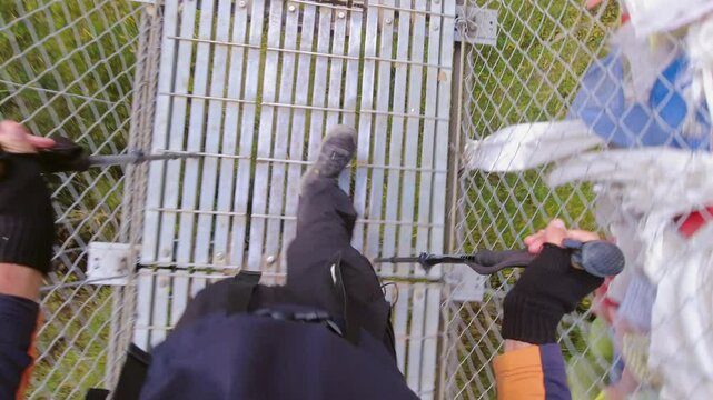 Close up pov trekker wear black walk over pass famous Hillary suspension metal bridge on the way to Everest base camp. EBC trek. Popular challenging trek Himalayas outdoors Nepal