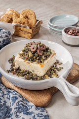 Feta cheese served hot in one block.
Delicious goat cheese topped with a tapenade made of olives and capers.
