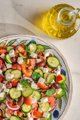 Greek salad with fresh vegetables, feta cheese and black olives.
Also called in Greek "Horiatiki Salata" which means Greek Village Salad. 